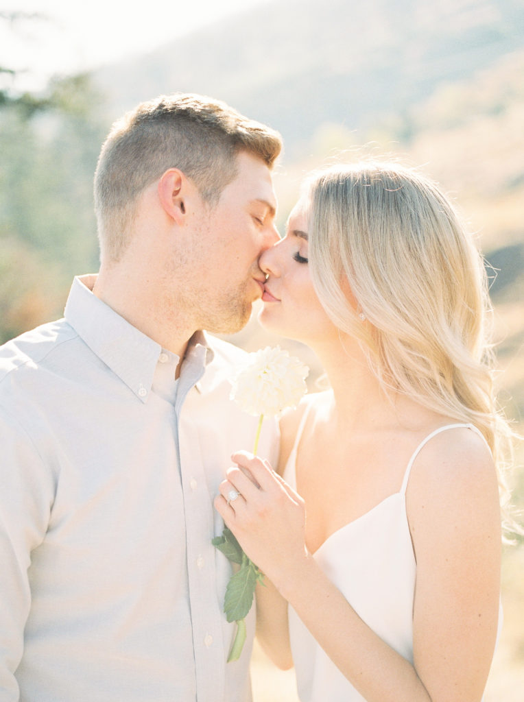 an engaged couple kiss at sunrise in Kelowna 