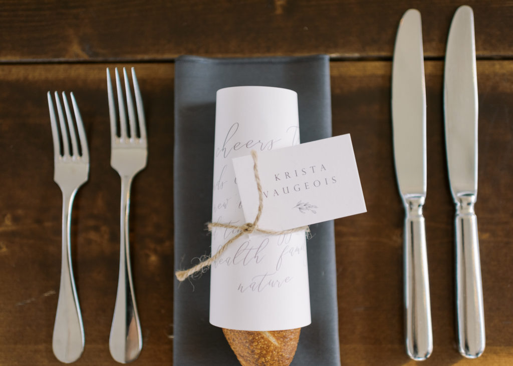 a wrapped bread guest place card at a Kelowna tented wedding 