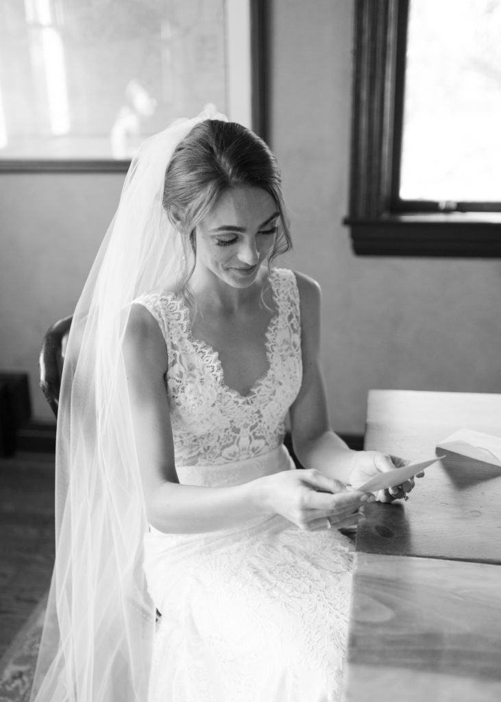 a bride reading a letter from her groom 