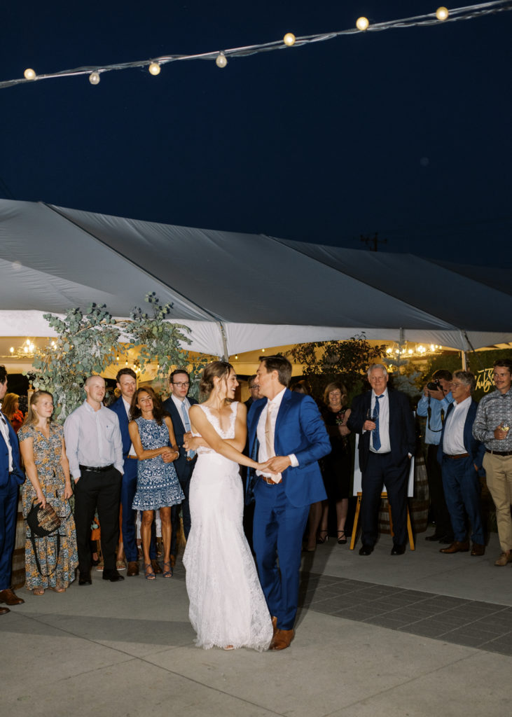 a bride and groom dance outdoors at their Kelowna tented wedding 