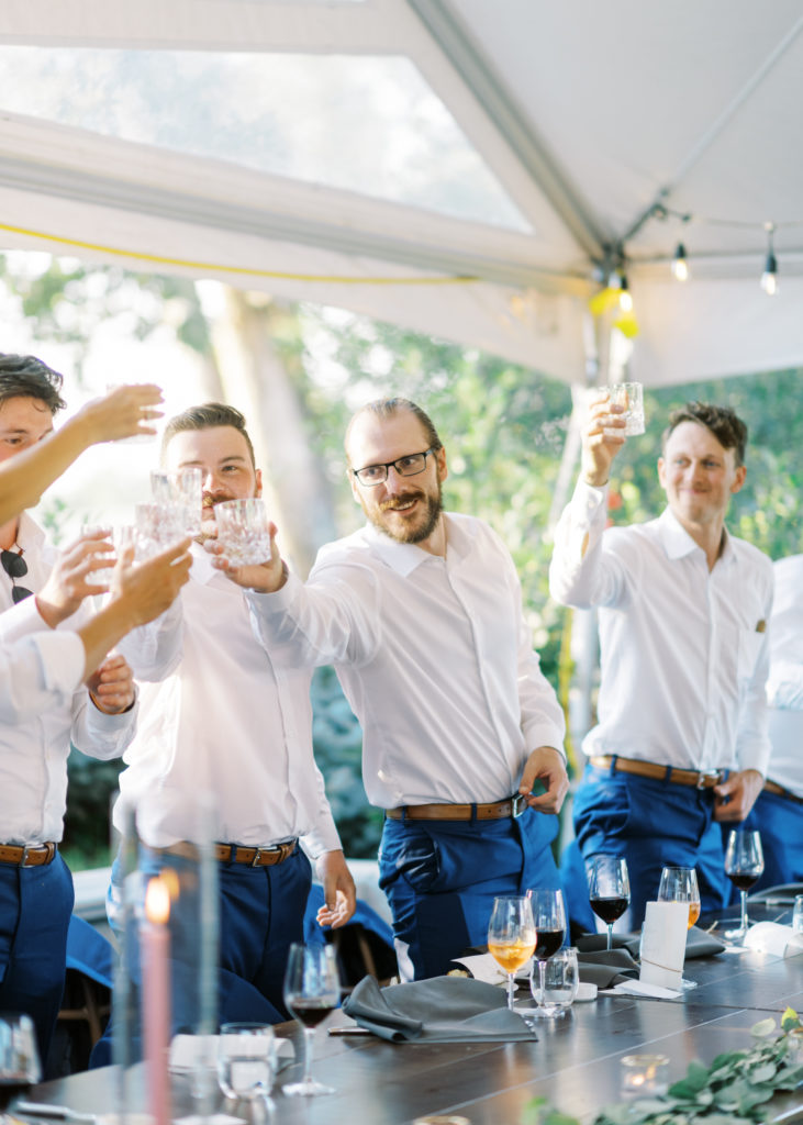 groomsmen toast at a Kelowna tented wedding reception