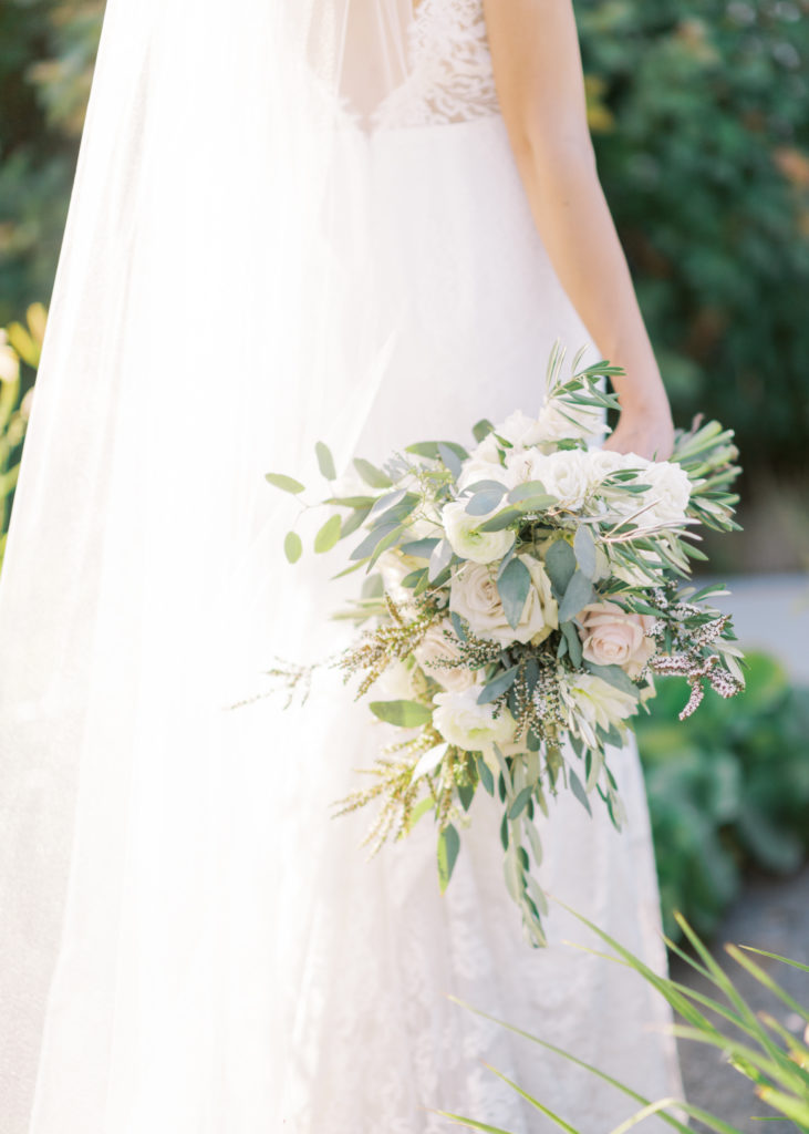 a bride holding an elegant bridal bouquet 