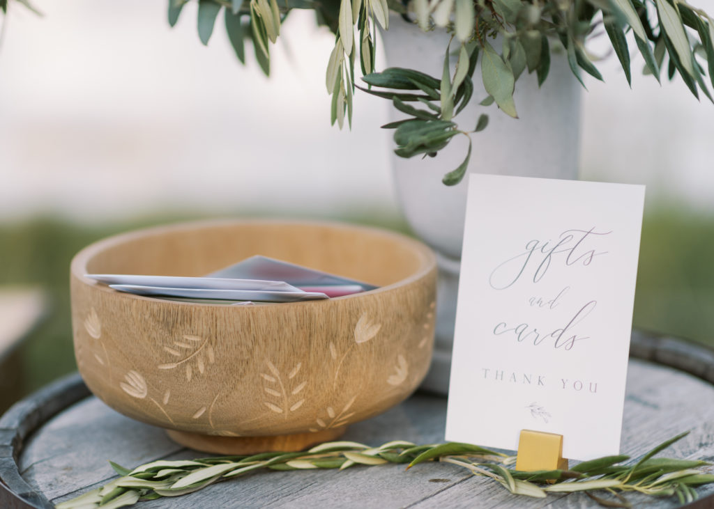 olive leaf and wood wedding decor 