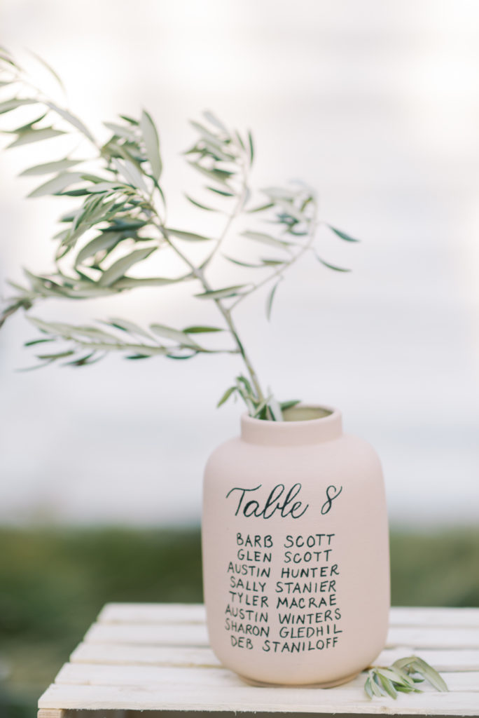a pink ceramic vase wedding seating chart for a Kelowna tented wedding 