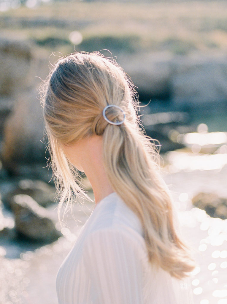 a bridal ponytail updo for her beach wedding 