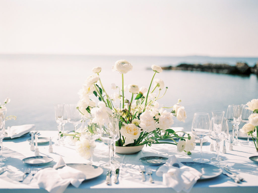 Neutral floral decor at an outdoor wedding reception on Vancouver beach