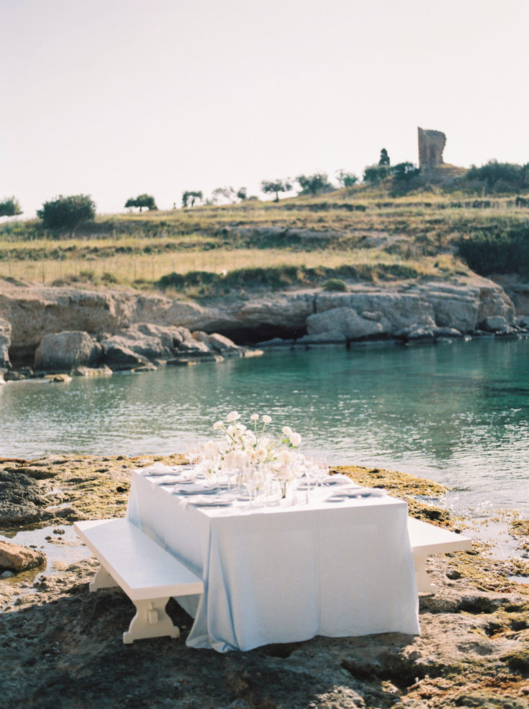 an elegant outdoor wedding reception table set up on Vancouver beach 