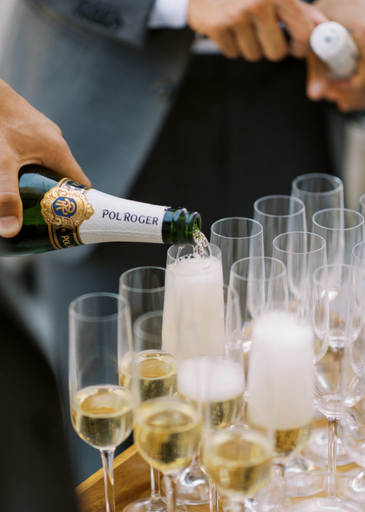 champagne is poured at a wedding reception 
