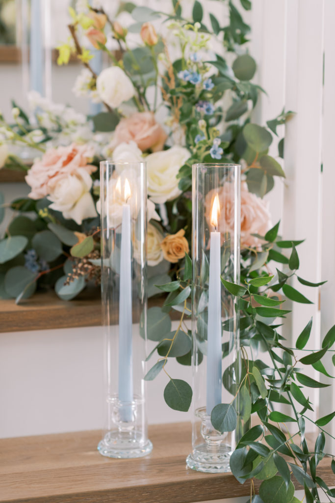 light blue taper candles as wedding ceremony decor