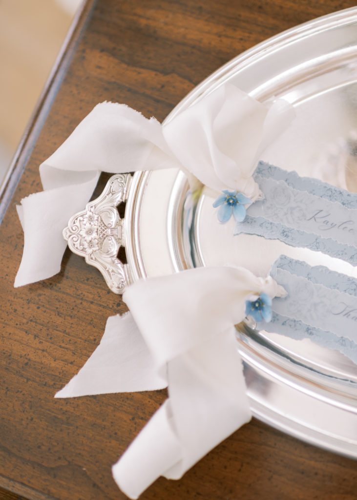 blue wedding escort cards with satin ribbon