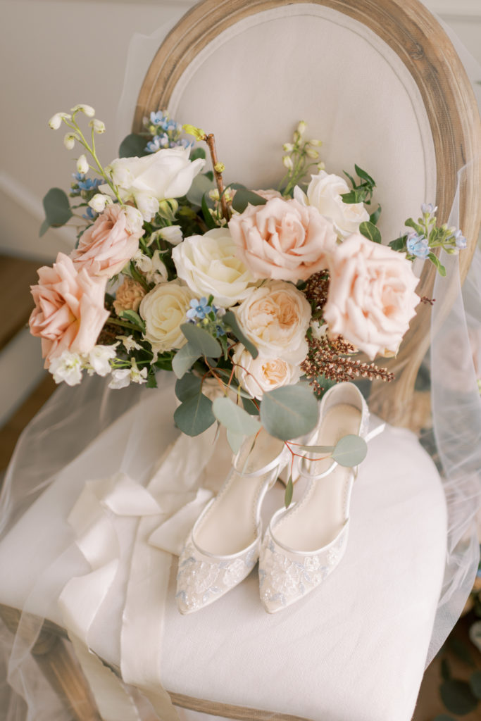 blue bridal shoes with an elegant bridal bouquet 