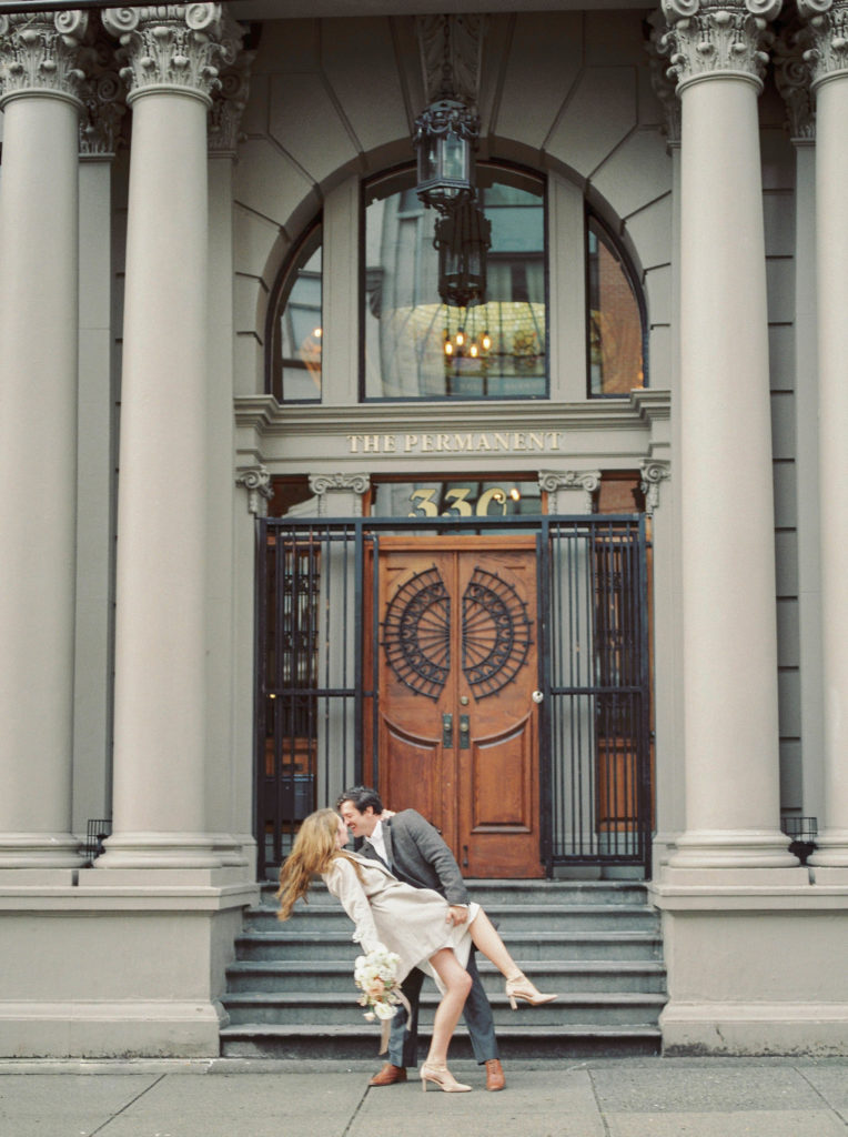 a bride and groom kiss at the Permanent venue in Vancouver 