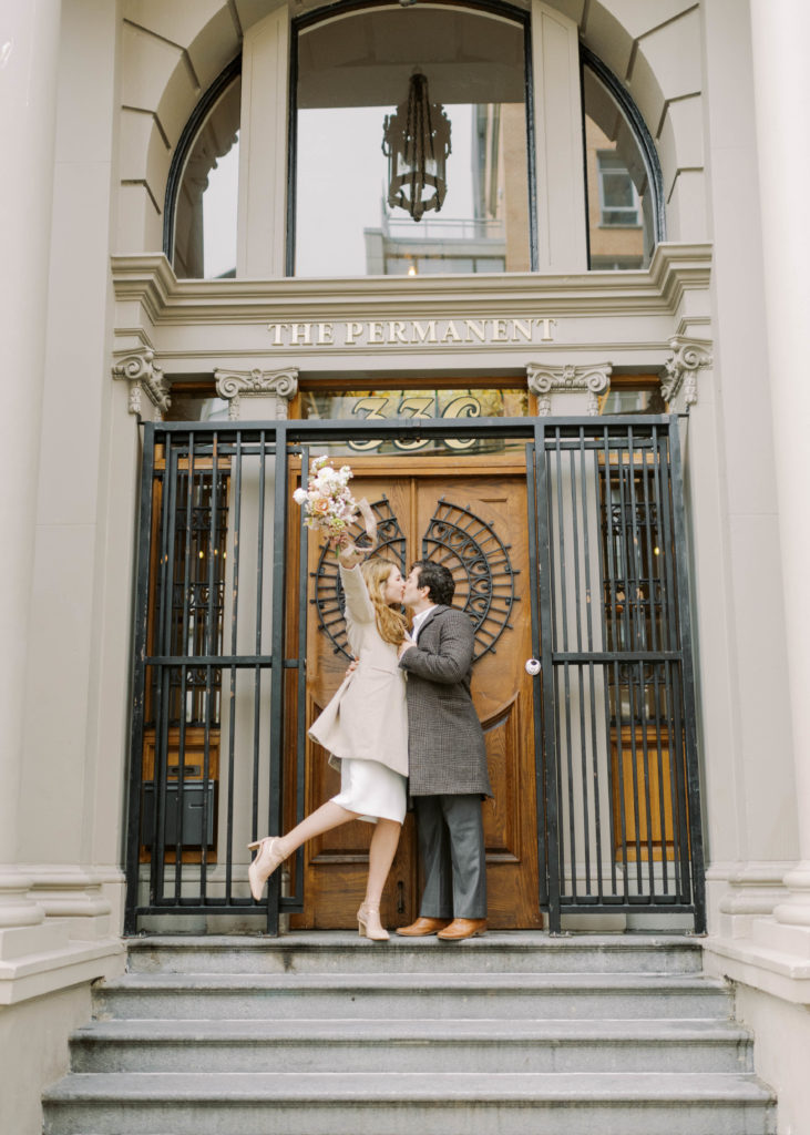 Bride and groom kiss after Downtown Vancouver wedding ceremony 
