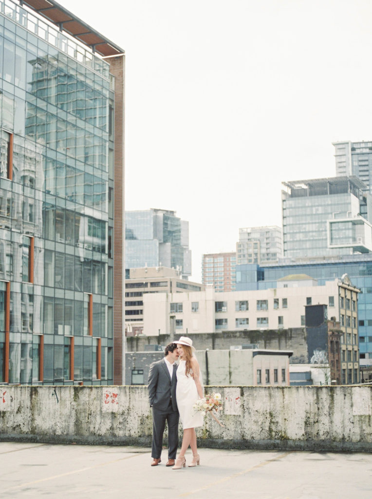bride and groom portraits on top of a Vancouver parkade 