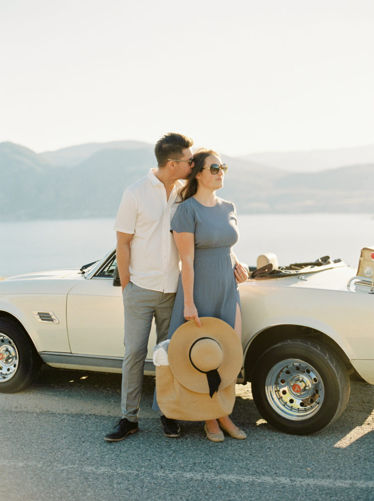 a couple on a scenic cliff for an Okanagan couples session 