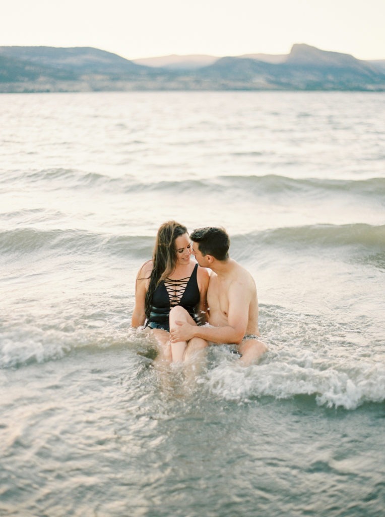 a couple swim for their Okanagan couples session 